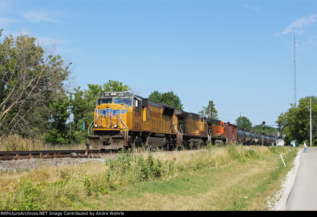 A mix of UP and BNSF power hauls empty oil cans west on the CP